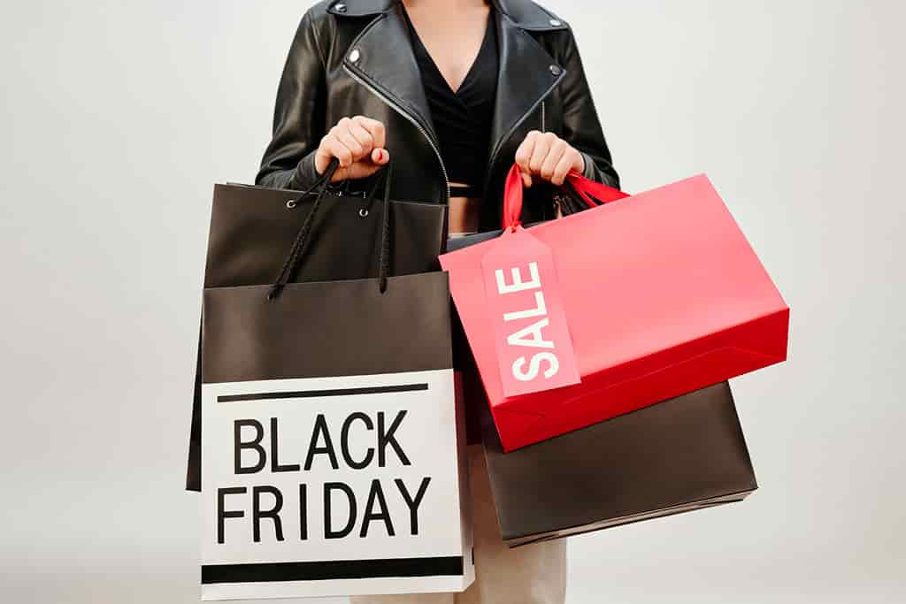 Woman carying Black Friday shopping bags